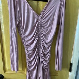 Blush long sleeved scrunch mini dress. Runs small